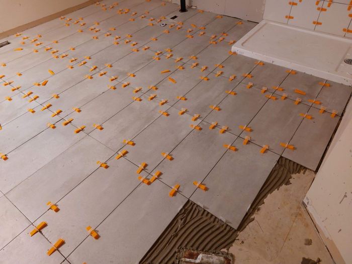 Before: Ensuite: tile going in to finished