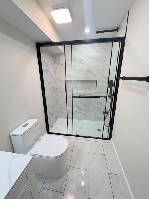Bathroom - black-frame glass shower